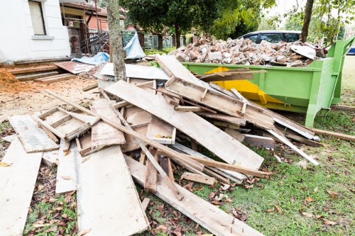 Professional furniture clearance team in Crouch End working on a sofa