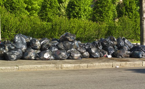 Local waste removal team assisting residents